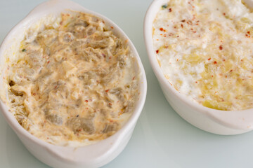 Turkish Mezes: Carrot Tarator and Haydari on White Glass Surface
