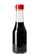 Clear glass bottle of dark brown, viscous soy sauce with surface bubbles and a bright red pouring cap, isolated on white background with copy space, concept for asian cuisine condiment