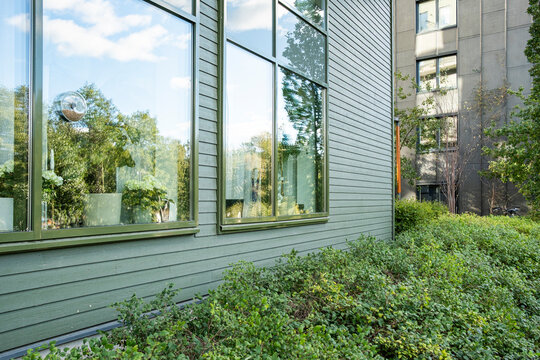 Landscaped courtyards between new apartment blocks in Stockholm, urban green spaces showing sustainable living, Scandinavian design and contemporary residential innovation