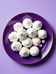 Purple plate of meringues photographed from above
