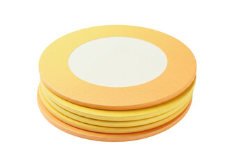 Isolated set of round coasters in yellow and orange shades, neatly stacked together