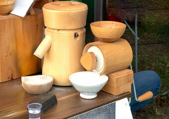 Flour mill grinder machine on wooden table in countryside
