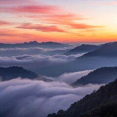 Obraz premium Majestic Mountain Range at Sunrise Covered in Clouds with Vibrant Colors in the Sky a Natural Beauty Landscape