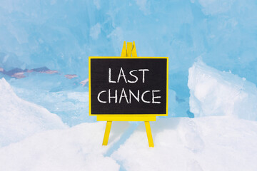 Last chance symbol. Concept word Last chance on beautiful black blackboard. Beautiful blue Baikal...