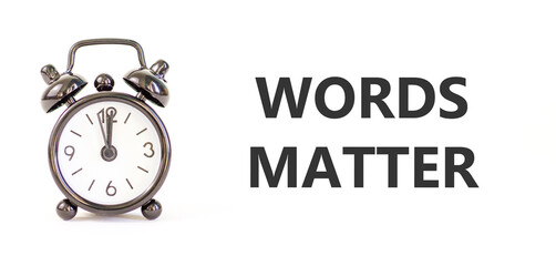 Words matter symbol. Concept word Words matter on beautiful white paper. Beautiful black alarm...