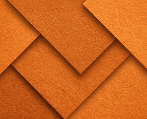 Fototapeta premium Abstract geometric pattern of overlapping orange felt squares.
