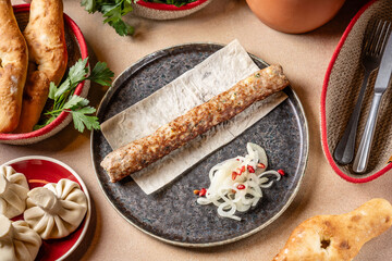 Georgian kebab with lavash, onion and bread