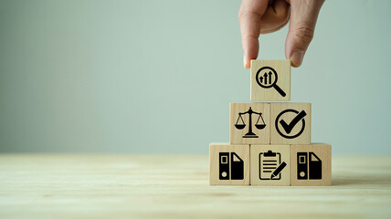 Hand places top wooden block audit regulation quality control management concept