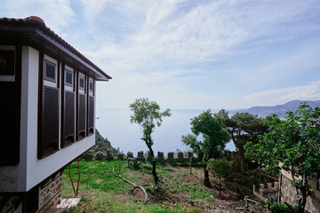 Scenic View of Coastal Landscape With Historic Architecture and Lush Greenery