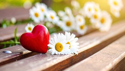 Red heart and daisies on a park bench