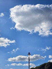 Street lamp againstcloudy sky background