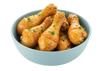 Delicious glazed chicken drumsticks in a bowl isolated, cooked poultry on no background