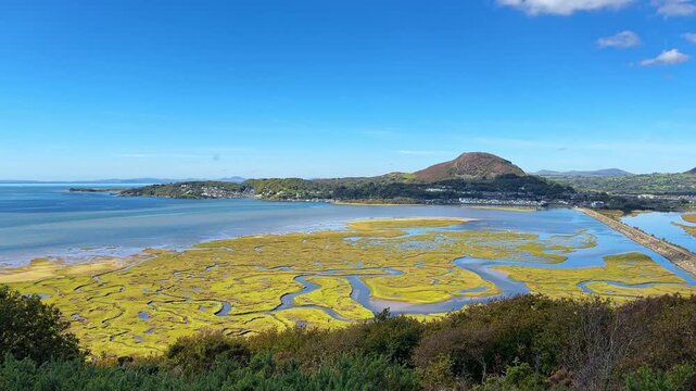 Top View to Porthmadog, Borth Y Gest, The Cob Road Rail and Footpath Cycle Path across Estuary and Snowdonia Mountains, Gwynedd, Wales, United Kingdom