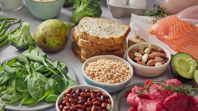 composition of various fresh protein diet products on grey background, top view. healthy eating, various fresh healthy products on grey table, top view. Healthy food clean eating selection