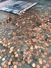 Pennies on Ground with Welcome Mat