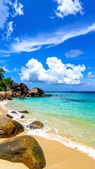Naklejka premium Tropical beach scene with turquoise water and puffy clouds