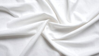 Close-up of softly lit white fabric, draped and folded with varying depths of shadows