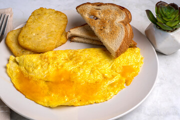 cheese omelette with  toast and hashed browns
