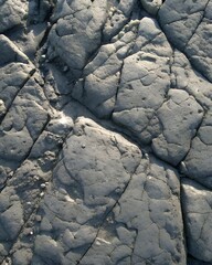 Rough Gray Limestone Texture Background with Natural Fractured Patterns for Rustic and Architectural Design