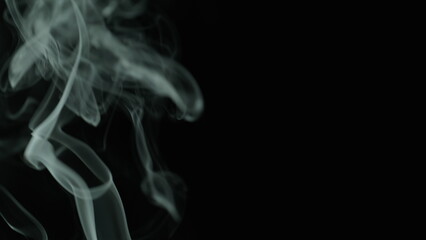 Fototapeta premium Closeup thin stream smoke from extinguished candle after meditation in studio