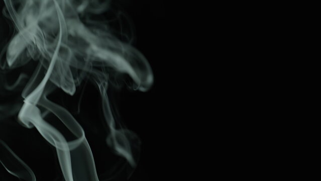 Closeup thin stream smoke from extinguished candle after meditation in studio - Powered by Adobe