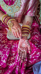 Haldi being applied on Bride's hand during Marriage, Hindu Wedding Ritual. Bride's hand with henna...