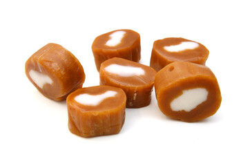 Caramel candies isolated on white background