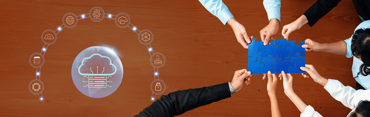Diverse team engages in collaborative puzzle-solving while exploring cloud technology connections, symbolizing innovation and strategic growth in a modern business environment. Trope