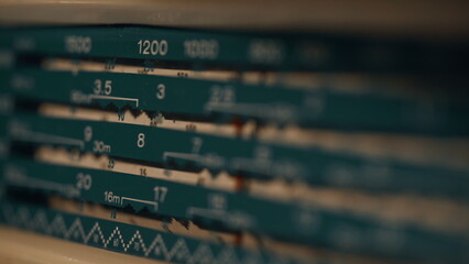 Obraz premium Vintage radio receiving signal in home closeup. Macro view retro speaker 