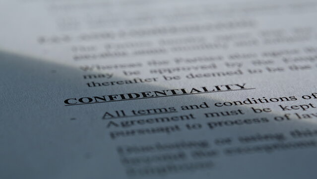 Closeup paper document confidentiality text. Macro shot security information