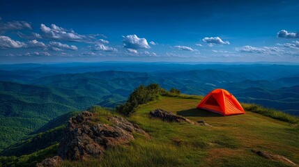 Vibrant Orange Tent on Mountain Ridge Under Clear Blue Sky