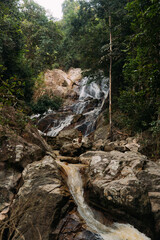 Fototapeta premium a small waterfall in Thailand, a landscape in the jungle of the islands of Southeast Asia