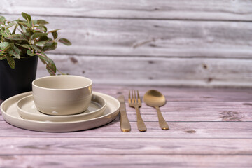Empty plates, knife and fork over wooden table background. View from top with copy space.lose...