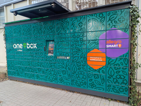 Warsaw, Poland - September 2, 2025: A modern outdoor One Box by Allegro for parcel pickup in Poland. Contactless delivery and online shopping on the street near residential buildings.
