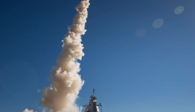 Gray naval corvette or frigate firing vertical launch missile with bright orange exhaust plume and white smoke cloud, modern warship on blue ocean waters during weapons test
