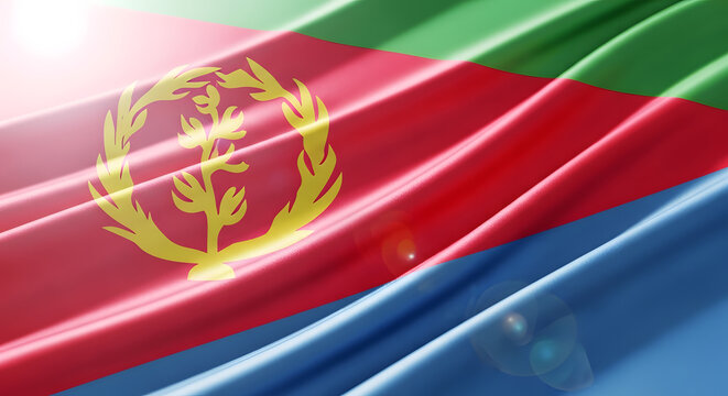 Close-up of the Eritrean flag waving in the wind, showing the emblem and colors.