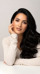 Fototapeta premium Elegant Portrait of a Beautiful Woman with Flowing Dark Hair, Soft Lighting and a Serene Expression, Ideal for Beauty and Lifestyle Content