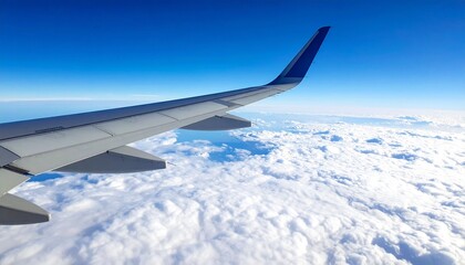 View from the airplane window, showing the wings of a modern airplane