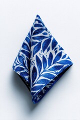 Vibrant Blue and White Leaf Patterned Fabric Folded into a Diamond Shape.