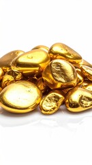 A pile of smooth, gold-painted stones rests on a bright white background, reflecting light