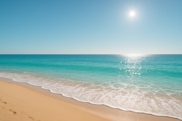 Turquoise Mediterranean beach with gentle waves and golden sand under clear summer sky