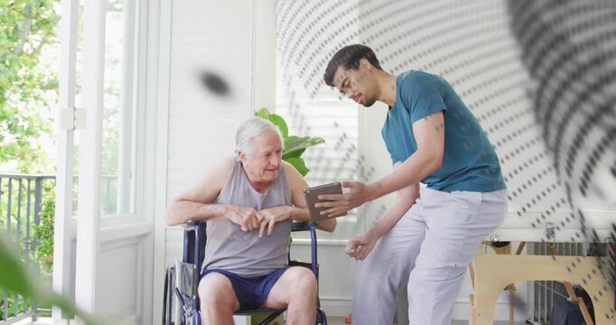 Caregiver presenting tablet in therapy area and guiding senior tapping interactive chart