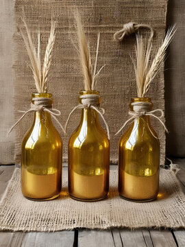 Golden elixir in vintage glass bottles tied with twine on a rustic burlap surface