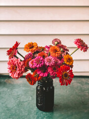 zinnias in jar