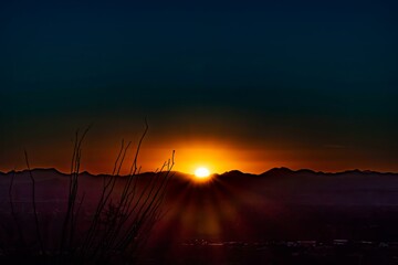 Sunset over the mountains at the Desert with cactus