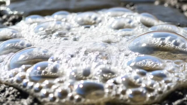Moving white foam circle in stagnant water with dirt, sewage and wastewater flow concept, video