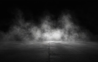 Misty fog illuminated on dark concrete floor with black background creating eerie atmosphere