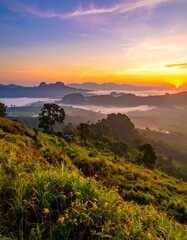 Panoramic sunrise over a misty mountain valley