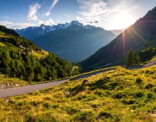 Mountain road winding through valley at sunset