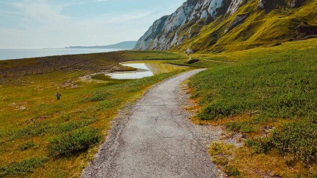 Samphire Hoe country park, Dover, Kent, England, UK, with chalk cliffs, sea wall paths and coastal meadows